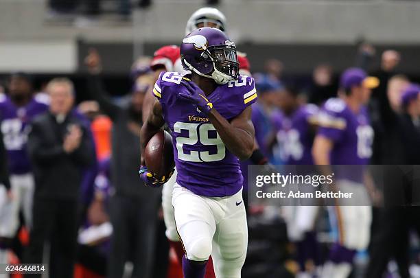 Xavier Rhodes of the Minnesota Vikings carries the ball for a touchdown after intercepting a pass in the second quarter of the game on November 20,...