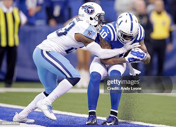 Donte Moncrief of the Indianapolis Colts is tackled by Brice McCain of the Tennessee Titans as he makes a touchdown pass in the first quarter of the...