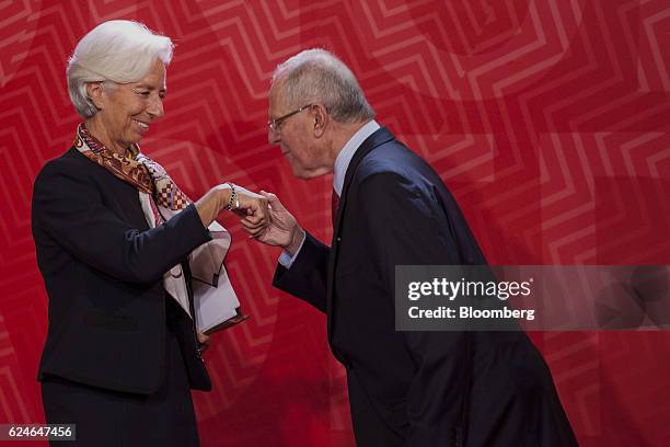 Pedro Pablo Kuczynski, Peru's president, right, greets Christine Lagarde, managing director of the International Monetary Fund , during the...