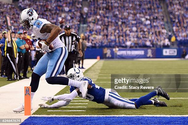Rishard Matthews of the Tennessee Titans catches a pass in front of Darius Butler of the Indianapolis Colts during the first half of a game at Lucas...