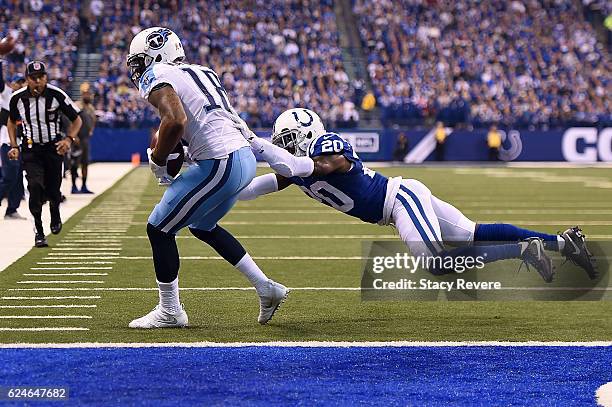 Rishard Matthews of the Tennessee Titans catches a pass in front of Darius Butler of the Indianapolis Colts during the first half of a game at Lucas...