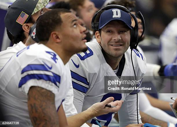 Tony Romo talks with Dak Prescott and Mark Sanchez of the Dallas Cowboys on the bench during the first half of the game against the Baltimore Ravens...