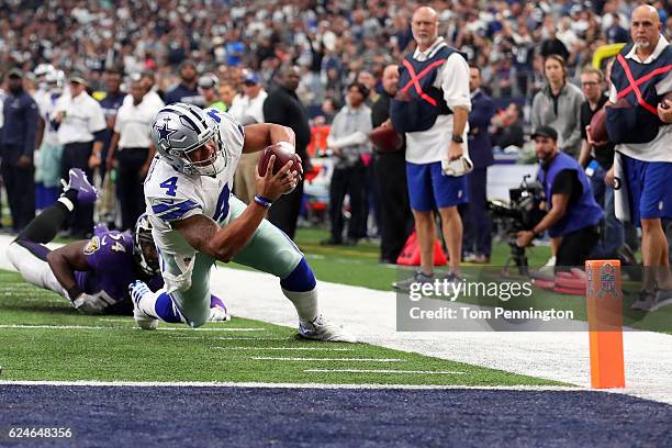 Dak Prescott of the Dallas Cowboys dives toward the end zone with the ball during the second quarter against the Baltimore Ravens at AT&T Stadium on...