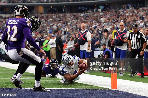 Dak Prescott of the Dallas Cowboys dives toward the end zone with the ball during the second quarter against the Baltimore Ravens at AT&T Stadium on...
