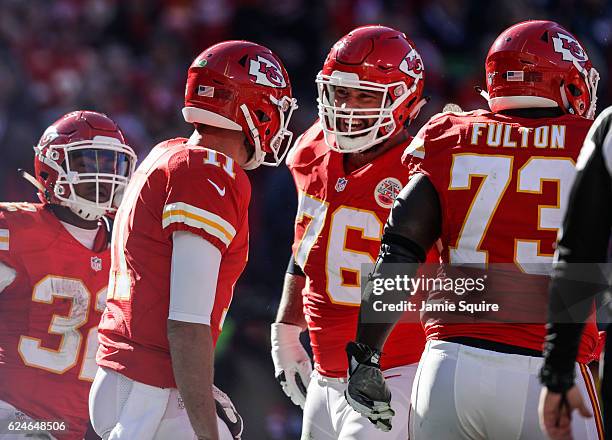 Offensive guard Laurent Duvernay-Tardif of the Kansas City Chiefs celebrates with Alex Smith after Smith slid in to the end zone scoring the games...