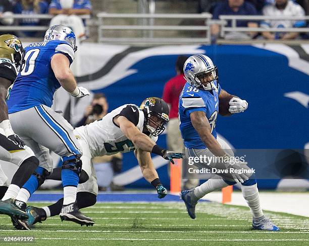 Dwayne Washington of the Detroit Lions avoids the tackle of Paul Posluszny of the Jacksonville Jaguars during an NFL game at Ford Field on November...