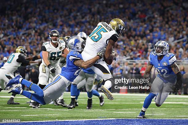 Allen Robinson of the Jacksonville Jaguars scores a touchdown against Darius Slay of the Detroit Lions and Tavon Wilson during second quarter action...