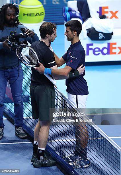 Champion Andy Murray of Great Britain is congratulated by Novak Djokovic of Serbia following the Singles Final against Novak Djokovic of Serbia at...