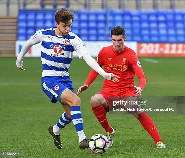 Corey Whelan of Liverpool and Tyler Frost of Reading in action during the Liverpool v Reading Premier League 2 game at Prenton Park on November 20,...