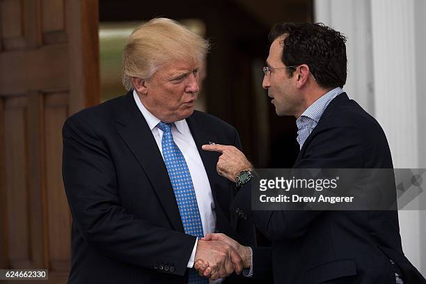 President-elect Donald Trump shakes hands with Jonathan Gray, member of the Board of Directors at Blackstone, following their meeting at Trump...