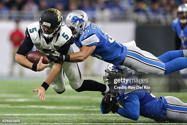 Miles Killebrew of the Detroit Lions and Ezekiel Ansah of the Detroit Lions tackle quarterback Blake Bortles of the Jacksonville Jaguars during first...