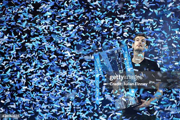 Andy Murray of Great Britain lifts the trophy following his victory during the Singles Final against Novak Djokovic of Serbia at the O2 Arena on...