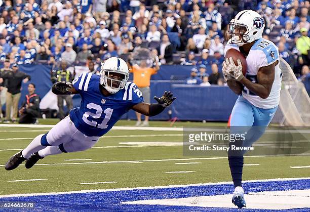 Tajae Sharpe of the Tennessee Titans breaks free from Vontae Davis of the Indianapolis Colts as he catches a touchdown pass during the third quarter...