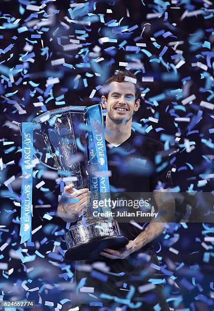 Andy Murray of Great Britain lifts the trophy following his victory during the Singles Final against Novak Djokovic of Serbia at the O2 Arena on...