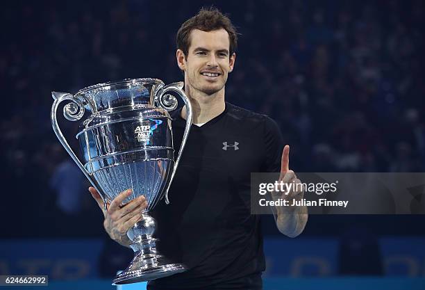 Andy Murray of Great Britain celebrates with the ATP Tour Trophy following his victory during the Singles Final against Novak Djokovic of Serbia at...