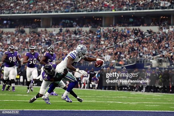 Dez Bryant of the Dallas Cowboys dives for the end zone to score a touchdown after catching a pass from Dak Prescott during the third quarter against...