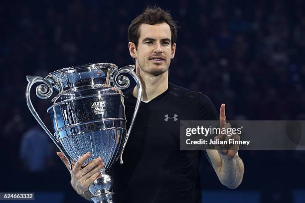 Andy Murray of Great Britain celebrates with the ATP Tour Trophy following his victory during the Singles Final against Novak Djokovic of Serbia at...