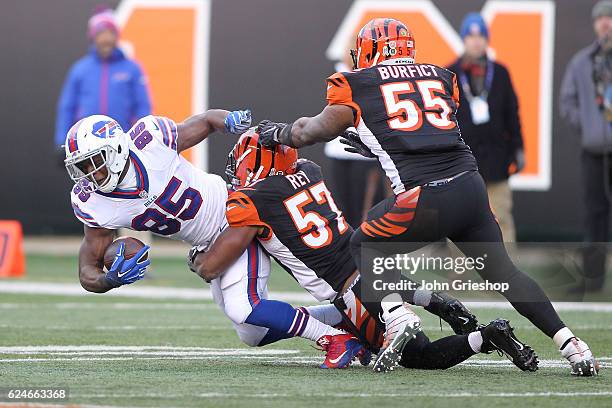 Charles Clay of the Buffalo Bills is tackled by Vincent Rey of the Cincinnati Bengals during the third quarter at Paul Brown Stadium on November 20,...