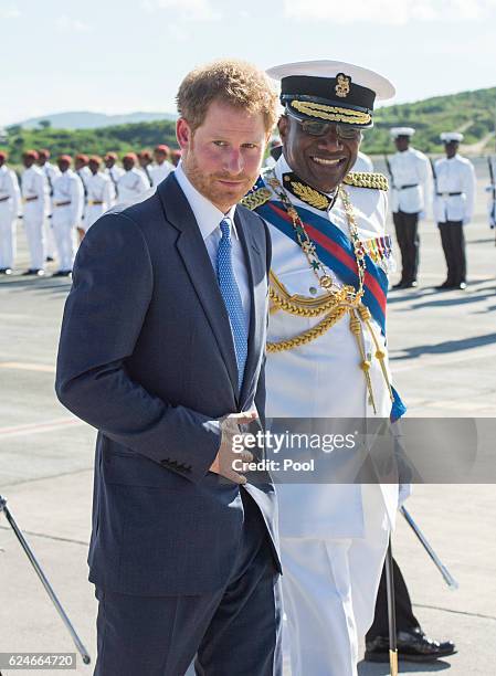 Prince Harry is greeted by the Governor General His Excellency Sir Rodney Williams as he arrives at VC Bird International Aiport on the first day of...