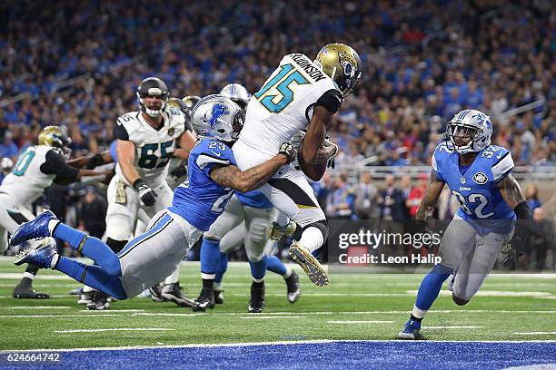 Allen Robinson of the Jacksonville Jaguars scores a touchdown against Darius Slay of the Detroit Lions and Tavon Wilson during second quarter action...