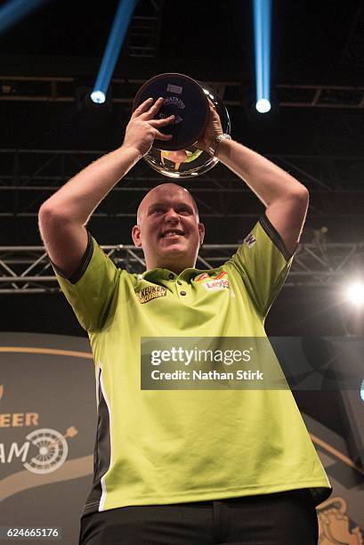 Michael van Gerwen of the Netherlands celebrates winning the SINGHA Beer Grand Slam of Darts against James Wade at Wolverhampton Civic Hall on...