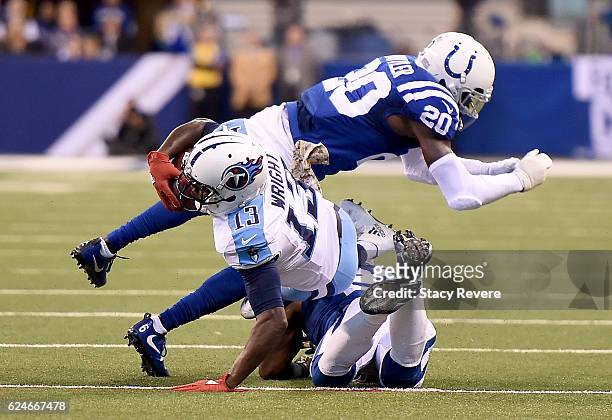 Kendall Wright of the Tennessee Titans is tackled during the fourth quarter of the game against the Indianapolis Colts at Lucas Oil Stadium on...