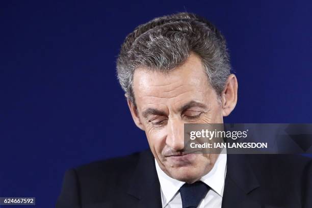 Former French President and candidate for the French right-wing presidential primary Nicolas Sarkozy delivers a speech at his campaign headquarters...