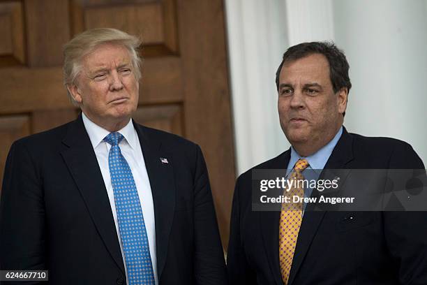 President-elect Donald Trump and New Jersey Governor Chris Christie stand together before their meeting at Trump International Golf Club, November...