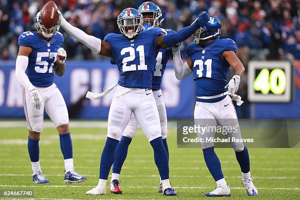 Landon Collins of the New York Giants celebrates with teammates after an interception in the final minutes as they defeated the Chicago Bears 22-16...
