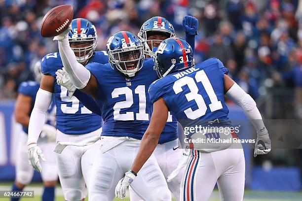 Landon Collins of the New York Giants celebrates with teammates after an interception in the final minutes as they defeated the Chicago Bears 22-16...