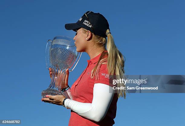 Charley Hull of England poses with the CME Tour Championship trophy during the final round of the CME Group Tour Championship at Tiburon Golf Club on...