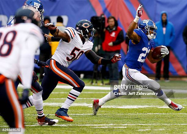 Rashad Jennings of the New York Giants gets by Jerrell Freeman of the Chicago Bears during their game at MetLife Stadium on November 20, 2016 in East...