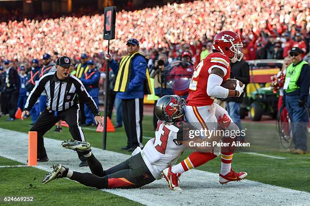 Wide receiver Albert Wilson of the Kansas City Chiefs catches a touchdown pass in front of strong safety Chris Conte of the Tampa Bay Buccaneers at...