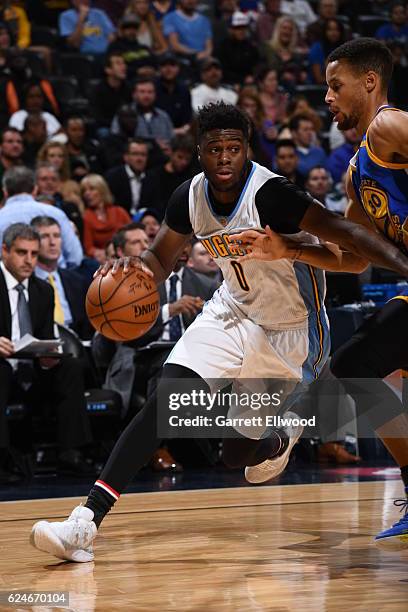 Emmanuel Mudiay of the Denver Nuggets drives to the basket during the game against the Golden State Warriors on November 10, 2016 at the Pepsi Center...