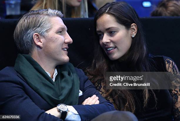 Bastian Schweinsteiger and Ana Ivanovic attend the Singles Final between Novak Djokovic of Serbia and Andy Murray of Great Britain at the O2 Arena on...