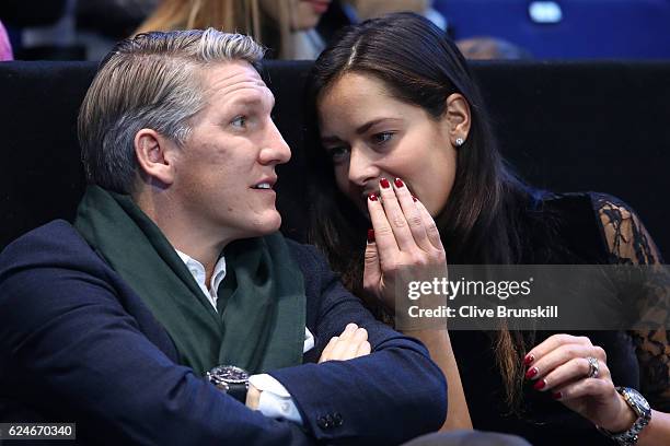 Bastian Schweinsteiger and Ana Ivanovic attend the Singles Final between Novak Djokovic of Serbia and Andy Murray of Great Britain at the O2 Arena on...