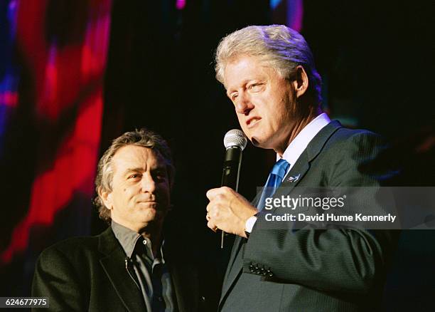 President Bill Clinton on stage with Robert De Niro at the 53rd birthday party for his wife, Hillary Clinton at the Rosebud Club in New York City on...