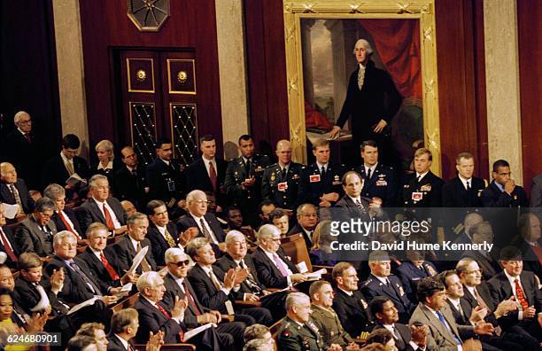 Members of the Joint Chambers of Congress listen to President Bill Clinton's State of the Union speech on January 20, 1999. Standing in the middle is...