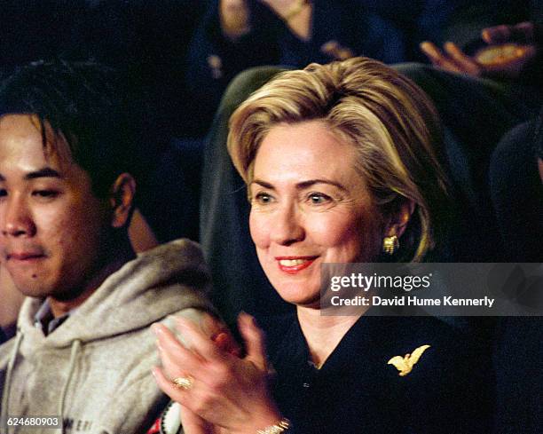 First Lady Hillary Clinton applauds during President Bill Clinton's State of the Union speech before a joint session of Congress on January 20, 1999.