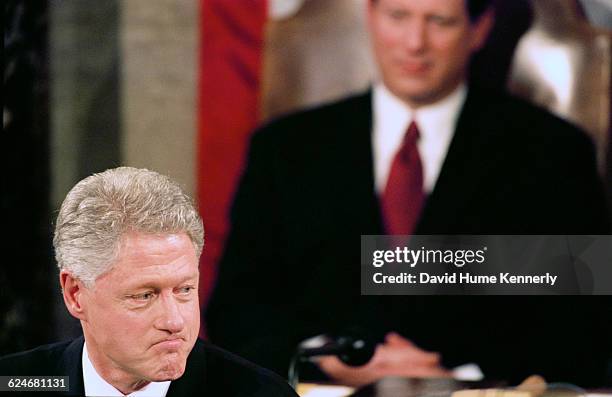 Vice President Al Gore listens to President Bill Clinton during the State of the Union speech before a joint session of Congress on January 20, 1999.