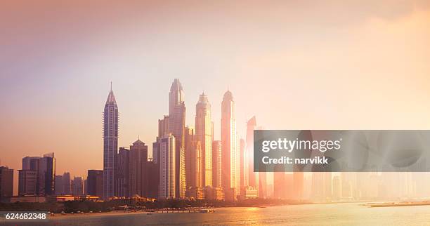 dubai marina cityscape in sunset light - panorama dubai stock pictures, royalty-free photos & images