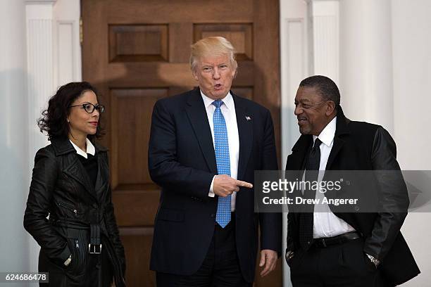 President-elect Donald Trump greets Robert Johnson , the founder of Black Entertainment Television, and his wife Lauren Wooden as they arrive for a...