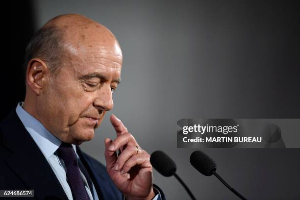 Candidate for the French right-wing presidential primary Alain Juppe delivers a speech at his campaign headquarters after the vote's first round, on...