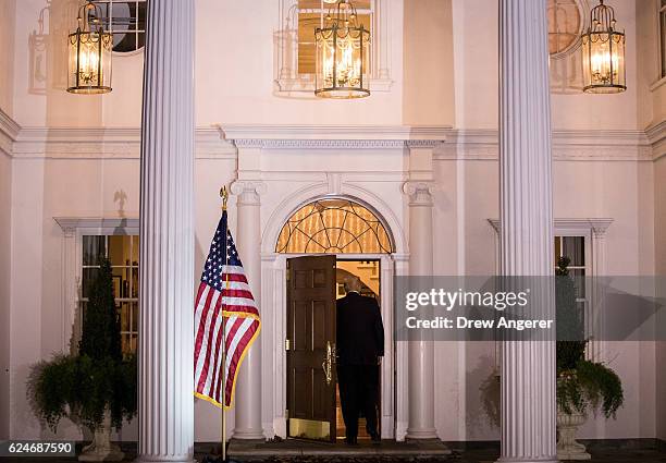 President-elect Donald Trump heads inside the clubhouse following his meeting with David McCormick, president of the management committee at...