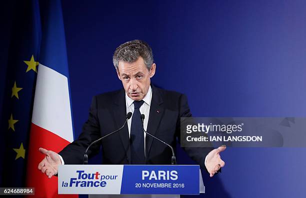 Former French President and candidate for the French right-wing presidential primary Nicolas Sarkozy delivers a speech at his campaign headquarters...