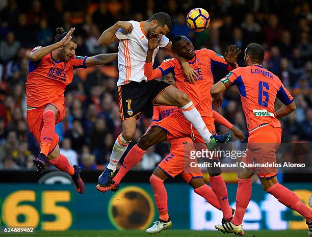 Uche Henry-Agbo of Granada competes for the ball with Mario Suarez of Valencia during the La Liga match between Valencia CF and Granada CF at...