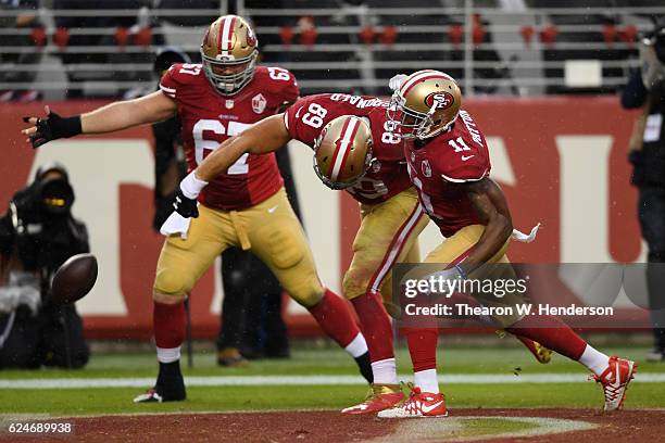 Vance McDonald of the San Francisco 49ers celebrates after scoring against the New England Patriots on a 18-yard pass during their NFL game at Levi's...