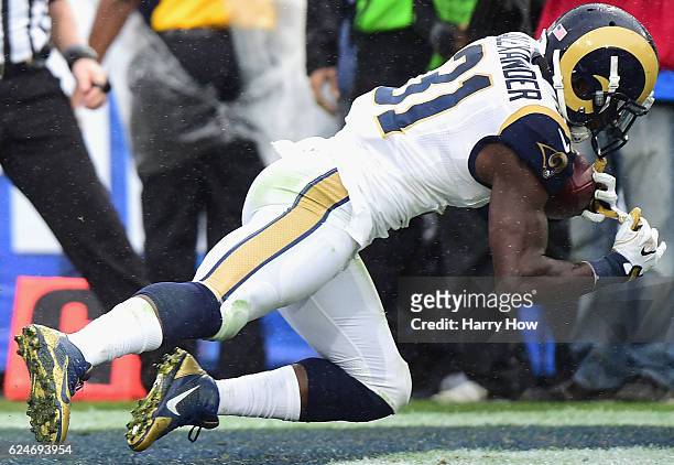 Maurice Alexander of the Los Angeles Rams makes an interception against the Miami Dolphins during the third quarter of the game at Los Angeles...