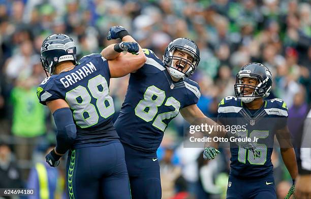 Tight end Jimmy Graham of the Seattle Seahawks celebrates his touchdown with teammate Tight end Luke Willson against the Philadelphia Eagles at...