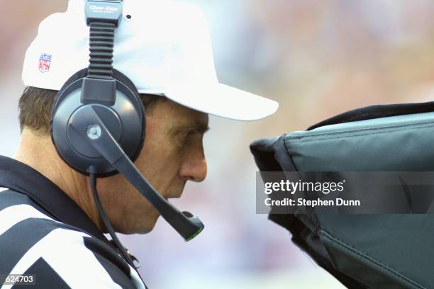 Referee Tony Corrente watches a video replay during a challenge by the Buffalo Bills versus the San Diego Chargers at Qualcomm Stadium in San Diego,...